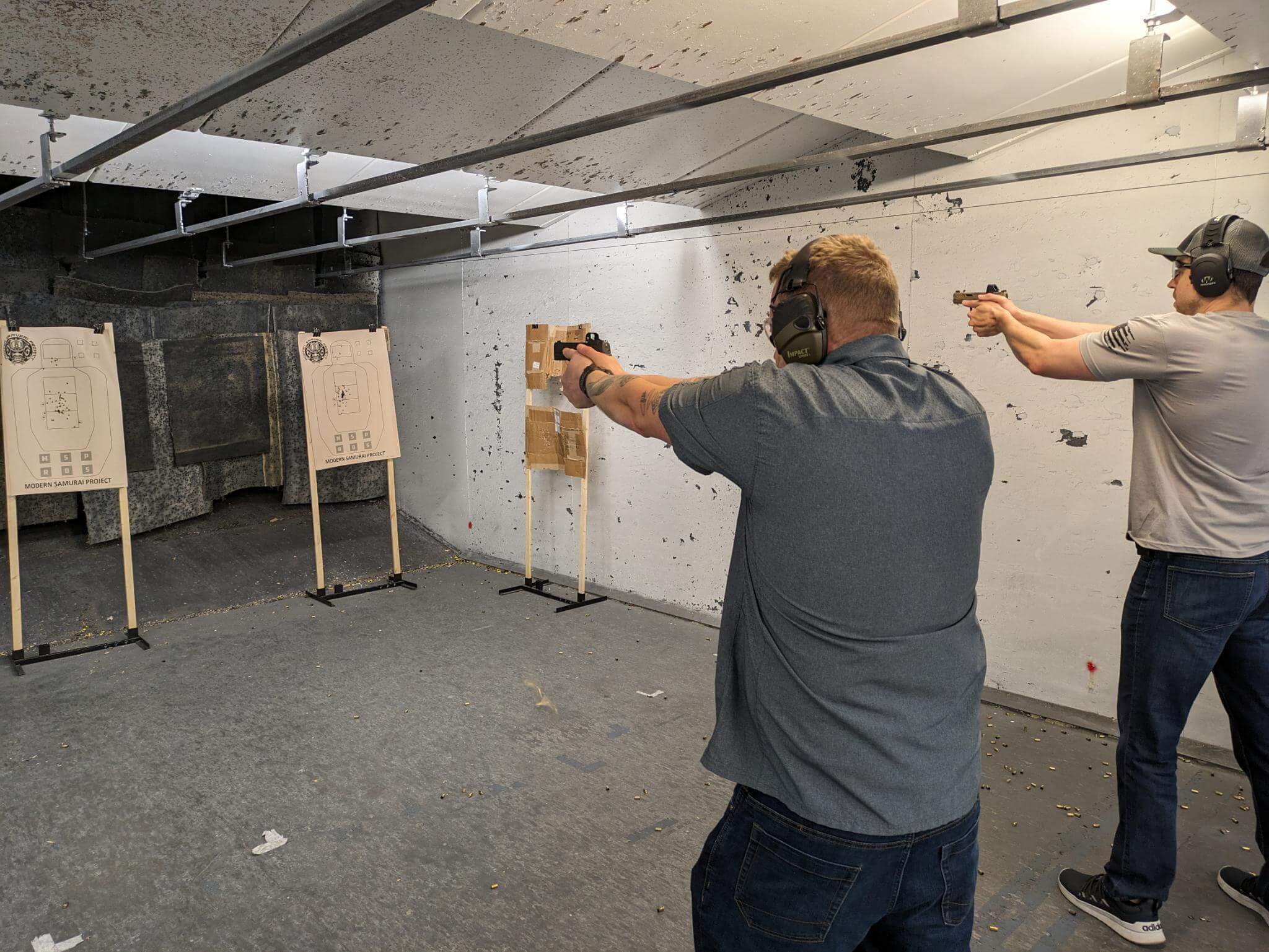 Live Fire class with two students aiming at targets